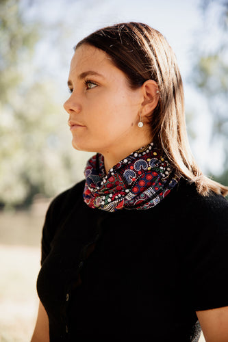 Example of the bandanna by Indigenous Wiradjuri Artist Owen Lyons being worn around the neck.