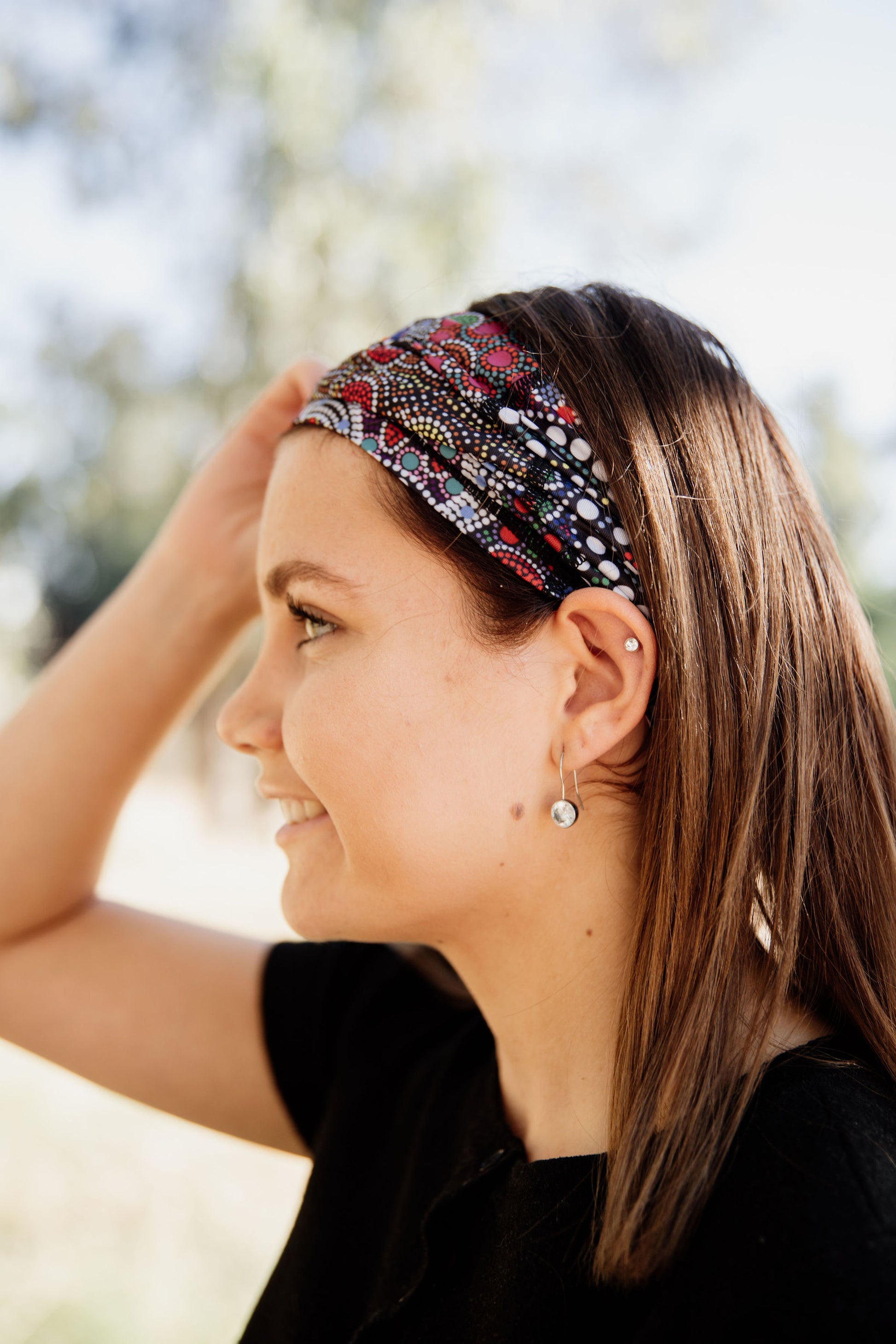 Example of the bandanna by Indigenous Wiradjuri Artist Owen Lyons being worn as a hair band