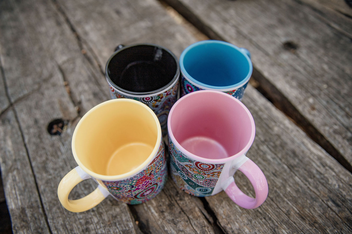 These Wiradjuri Art standard sized coffee mugs come printed with the Wiradjuri River People artwork. The mug can be purchased in the colour options of blue, pink, yellow or black for the handle and inside. Indigenous Art Aboriginal Art First Nations Art