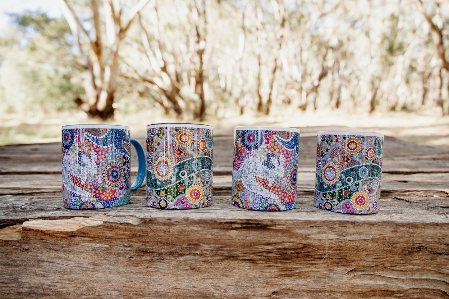 These Wiradjuri Art standard sized coffee mugs come printed with the Wiradjuri River People artwork. The mug can be purchased in the colour options of blue, pink, yellow or black for the handle and inside. Indigenous Art Aboriginal Art First Nations Art