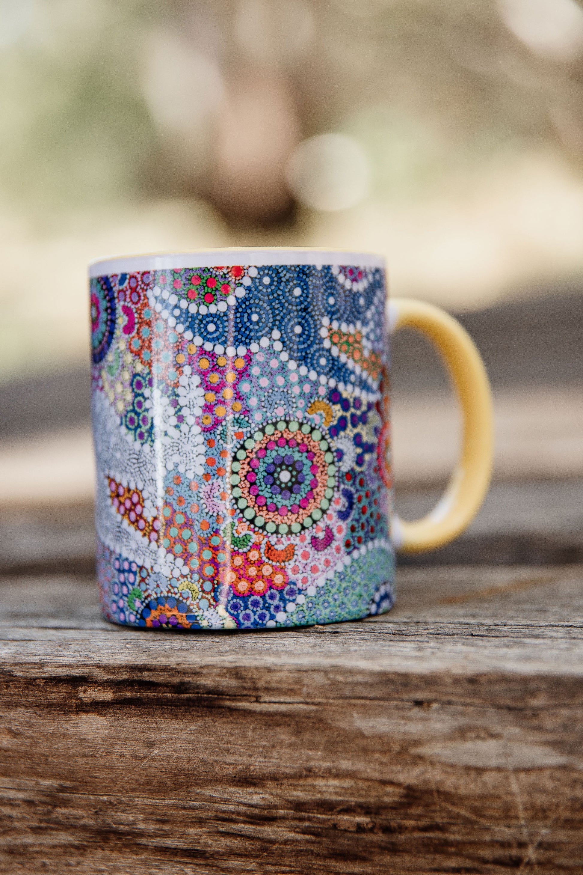 These Wiradjuri Art standard sized coffee mugs come printed with the Kangaroo Dreaming 2 artwork. The mug can be purchased in the colour options of blue, pink, yellow or black for the handle and inside. Indigenous Art Aboriginal Art First Nations Art
