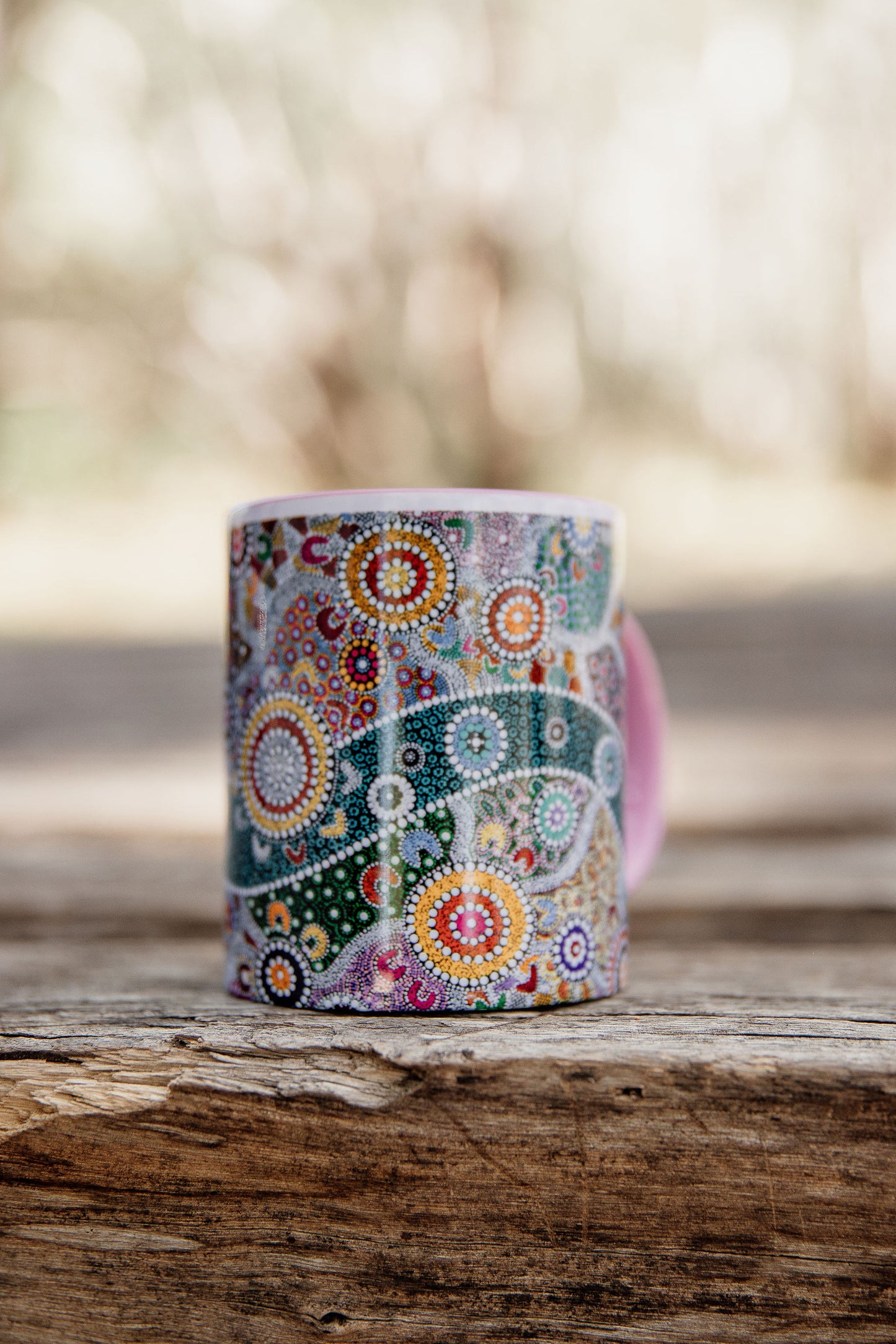 These Wiradjuri Art standard sized coffee mugs come printed with the Wiradjuri River People artwork. The mug can be purchased in the colour options of blue, pink, yellow or black for the handle and inside. Indigenous Art Aboriginal Art First Nations Art