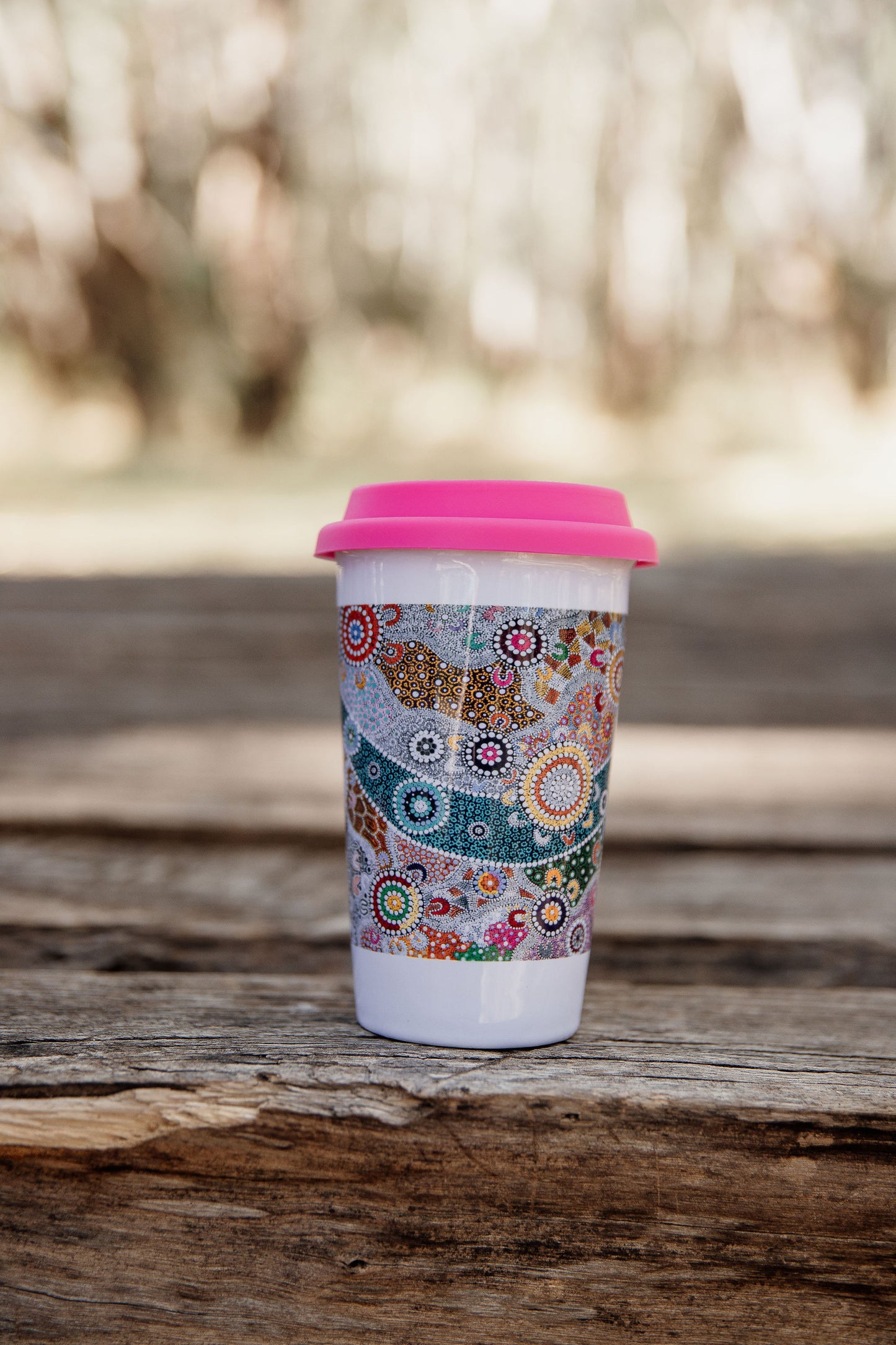 These Wiradjuri Art ceramic Keep Cups / Travel Mugs come printed with the Wiradjuri River People artwork. Cups are sold individually with the lid colour of your choice. There are three lid colours available - Blue, Pink and Orange. Indigenous Art Aboriginal Art First Nations Art