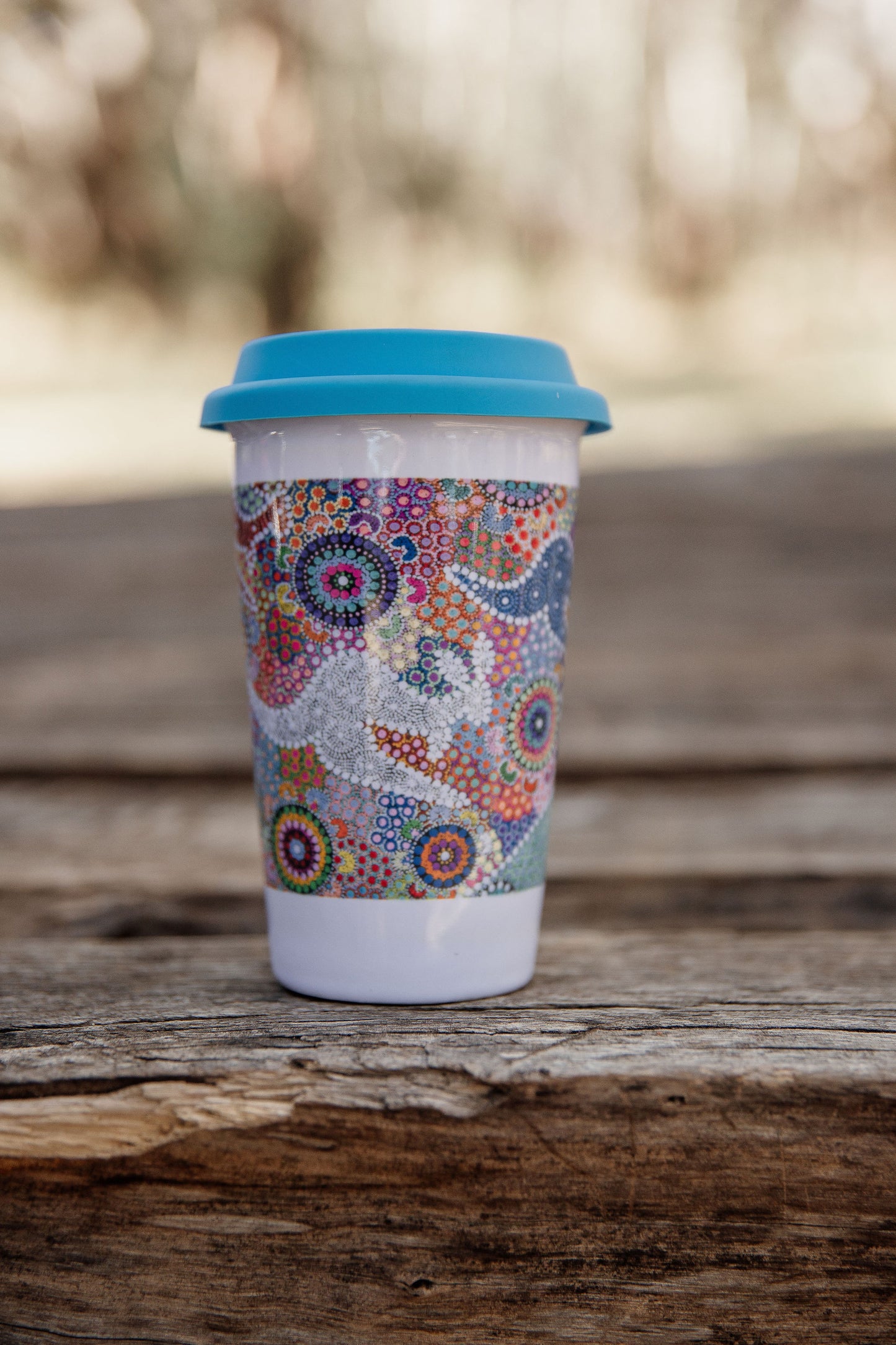 These Wiradjuri Art ceramic Keep Cups / Travel Mugs come printed with the Kangaroo Dreaming 2 artwork. Cups are sold individually with the lid colour of your choice. There are three lid colours available - Blue, Pink and Orange. Indigenous Art Aboriginal Art First Nations Art