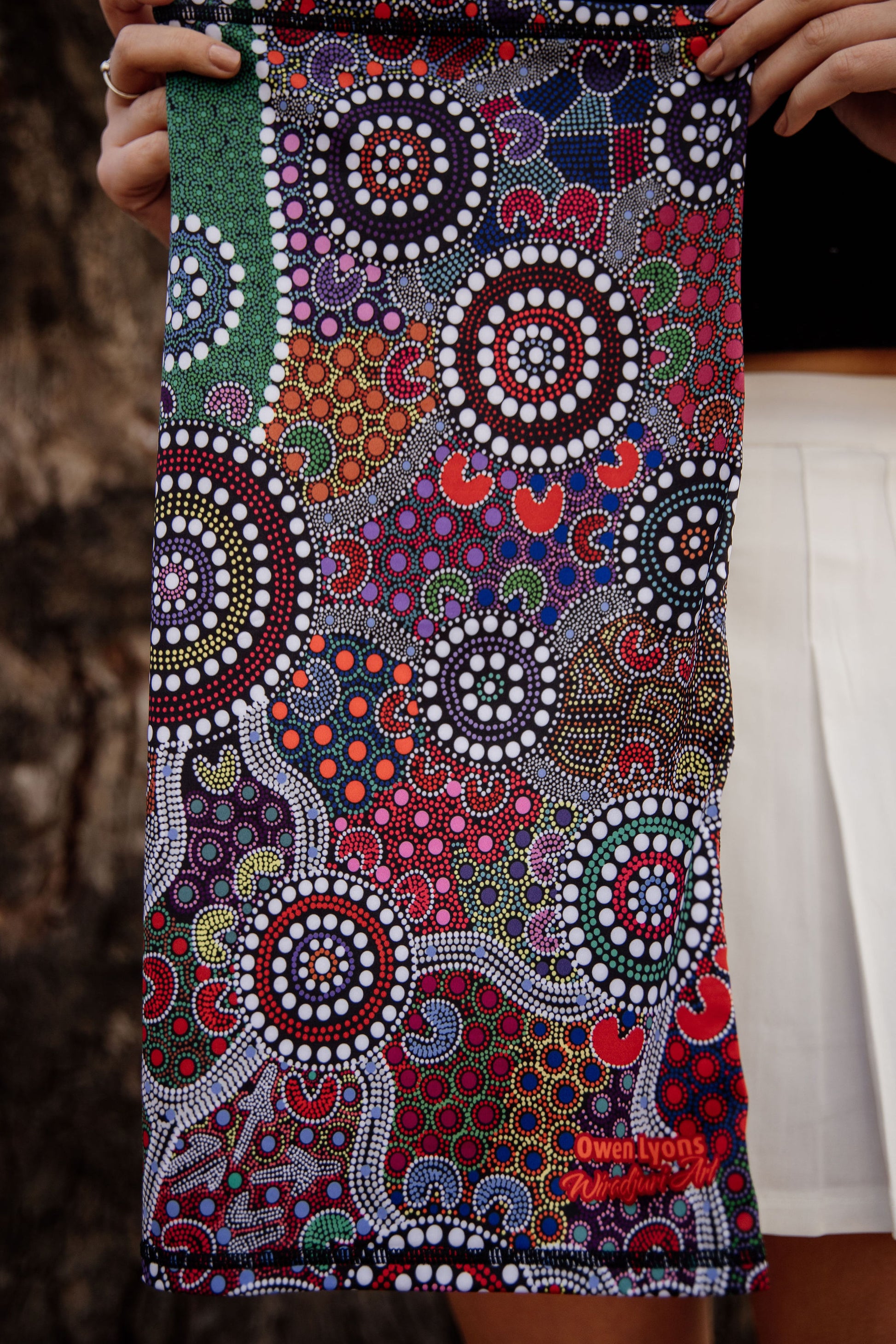 Example of the bandannas to show the length - NOTE: the one pictured has the previous logo. The bandannas in stock now have the new logo.