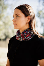 Load image into Gallery viewer, Example of the bandanna by Indigenous Wiradjuri Artist Owen Lyons being worn around the neck.
