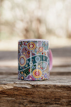 Load image into Gallery viewer, These Wiradjuri Art standard sized coffee mugs come printed with the Wiradjuri River People artwork. The mug can be purchased in the colour options of blue, pink, yellow or black for the handle and inside. Indigenous Art Aboriginal Art First Nations Art
