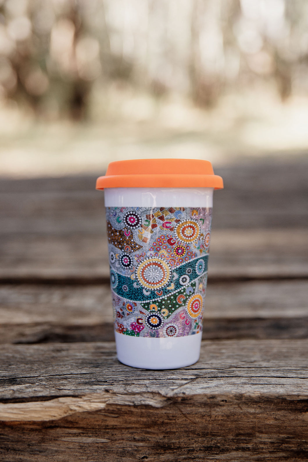 These Wiradjuri Art ceramic Keep Cups / Travel Mugs come printed with the Wiradjuri River People artwork. Cups are sold individually with the lid colour of your choice. There are three lid colours available - Blue, Pink and Orange. Indigenous Art Aboriginal Art First Nations Art