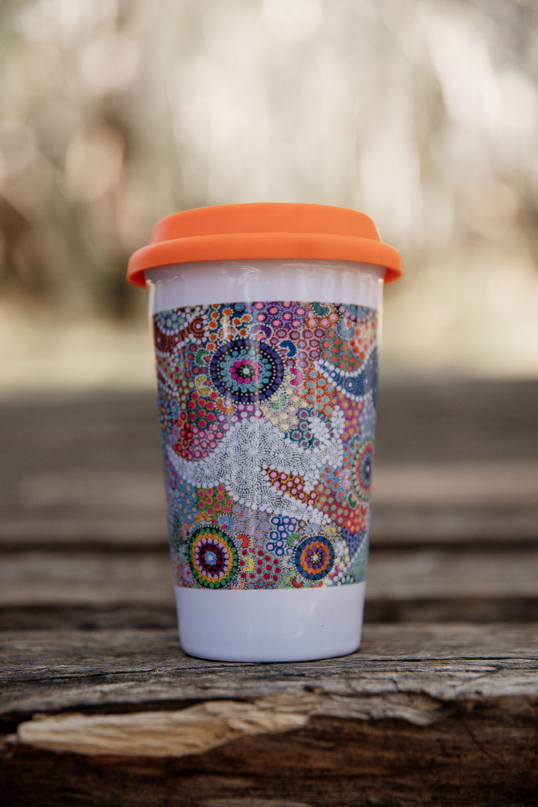 These Wiradjuri Art ceramic Keep Cups / Travel Mugs come printed with the Kangaroo Dreaming 2 artwork. Cups are sold individually with the lid colour of your choice. There are three lid colours available - Blue, Pink and Orange. Indigenous Art Aboriginal Art First Nations Art